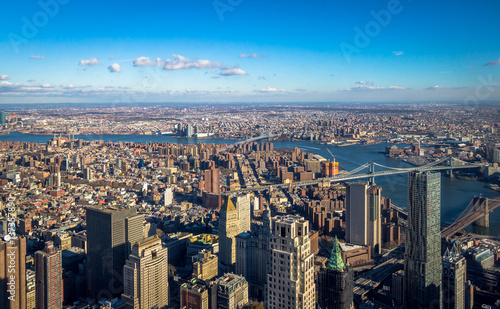 Fototapeta Naklejka Na Ścianę i Meble -  Skyline aerial view of Manhattan with skyscrapers, East River, Brooklyn Bridge and Manhattan Bridge - New York, USA