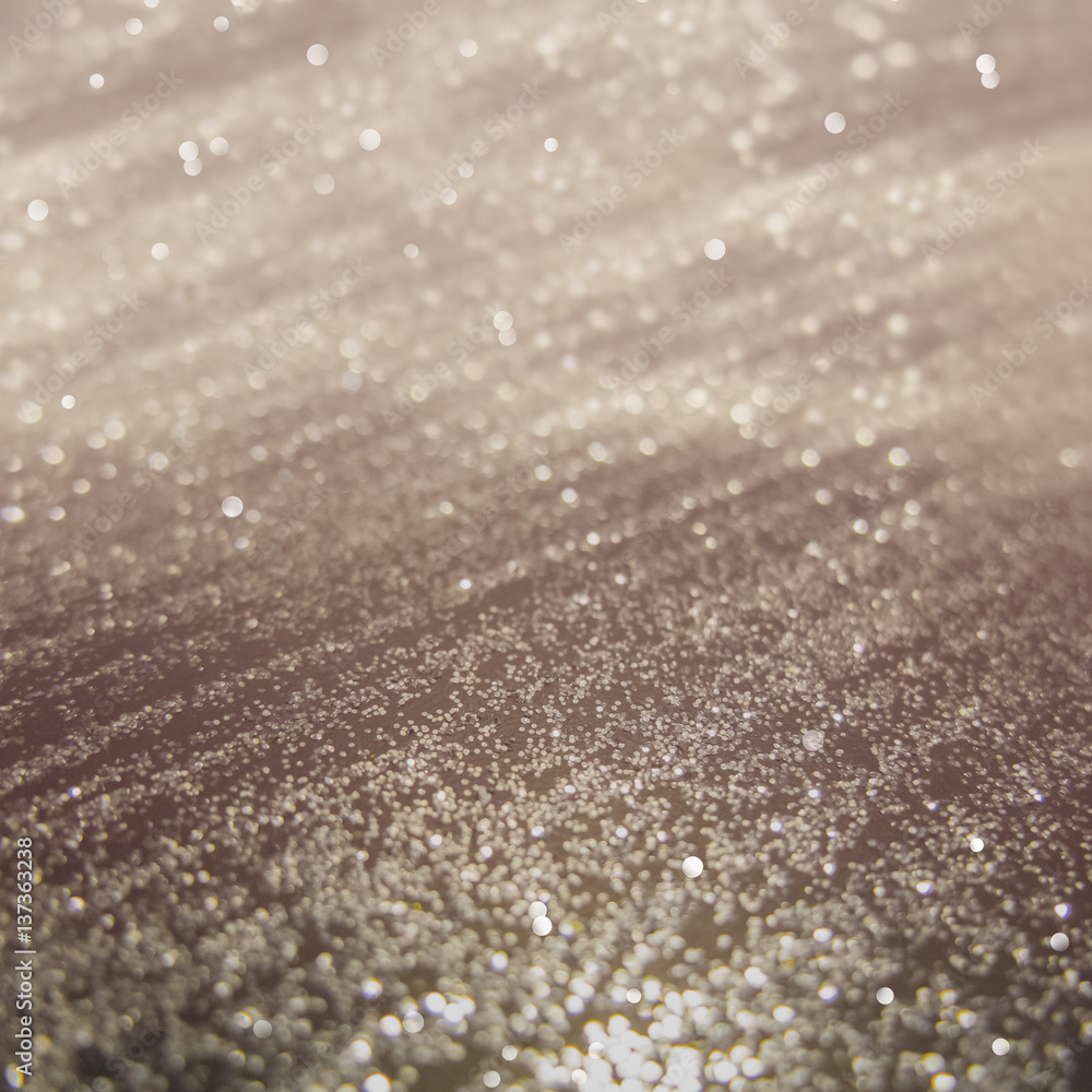 Abstract of Bright and sparkling bokeh background. golden bokeh-blurred lighting from glitter texture. Luxury design background. Abstract of Bright and sparkling bokeh background. golden bokeh-blurred lighting from glitter texture. Luxury design background.