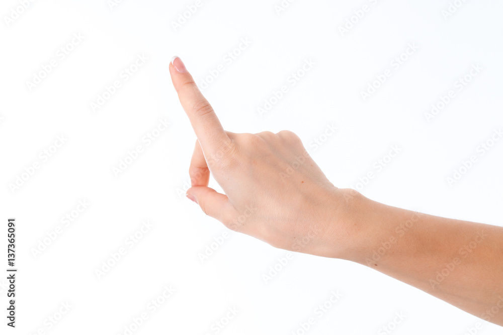 female hand outstretched forward with raised forefinger is isolated on a white background female hand outstretched forward with raised forefinger is isolated on a white background