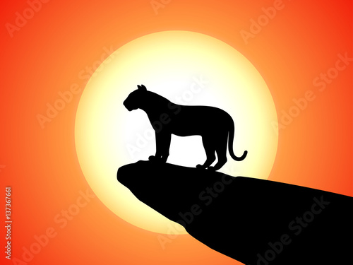 Vector silhouette tiger standing on rock on sunset © zhenyakot