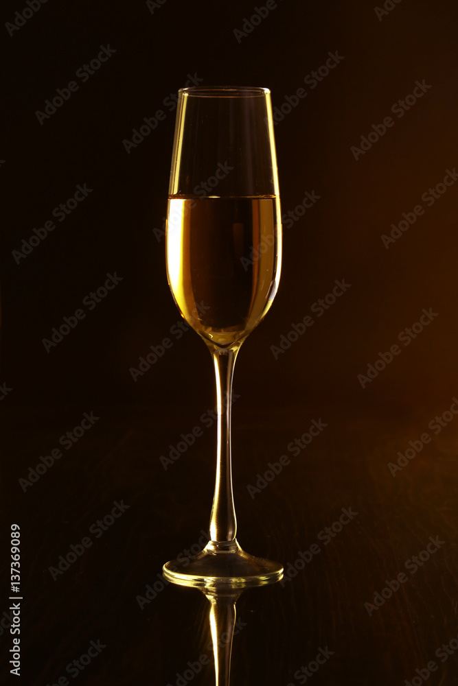Glasses with white wine on black mirror table. Celebrities composition. Glasses with white wine on black mirror table. Celebrities composition.