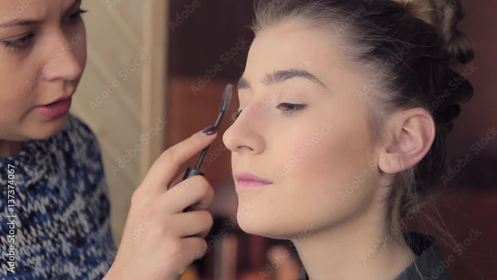 Makeup artist apply makeup on model brow Makeup artist apply makeup on model brow