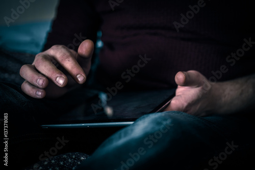 Old man uding his tablet with a fictional onbox folder email screen