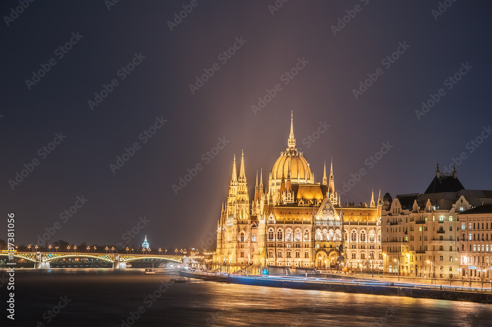 Night view of the Hungarian Parliament Building on the bank of the Danube in Budapest