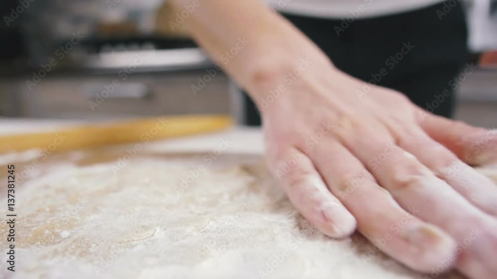 Making dough by female hands at home, slow motion Making dough by female hands at home, slow motion