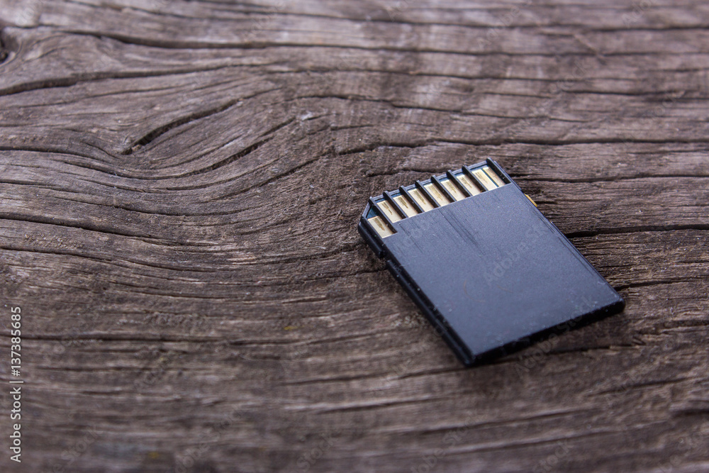 sd card on the wooden desk sd card on the wooden desk