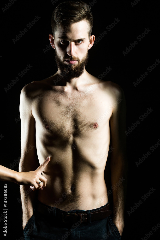 slim bearded man with thin bare torso isolated on black slim bearded man with thin bare torso isolated on black