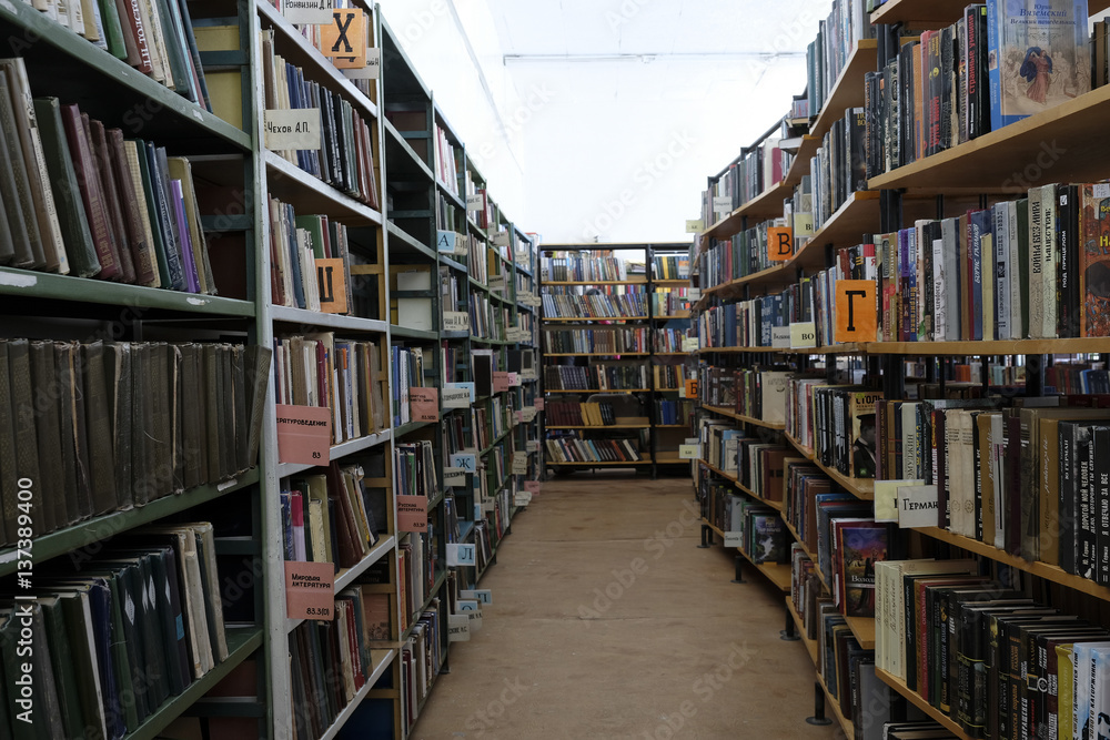 Moscow, Russia - February, 2, 2017: bookshelves in a library story in Moscow, Russia Moscow, Russia - February, 2, 2017: bookshelves in a library story in Moscow, Russia