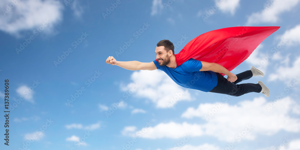 happy man in red superhero cape flying on air happy man in red superhero cape flying on air