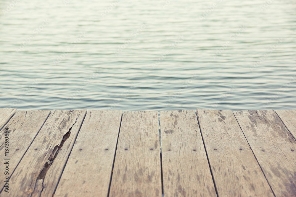 Wood plank floor on water surface background in vintage tone Wood plank floor on water surface background in vintage tone
