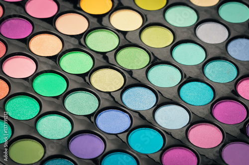 Macro shot of glossy make-up powder. Colorful makeup palette