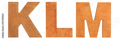 Old wooden letters KLM isolated on white background. One from the full alphabet set photo