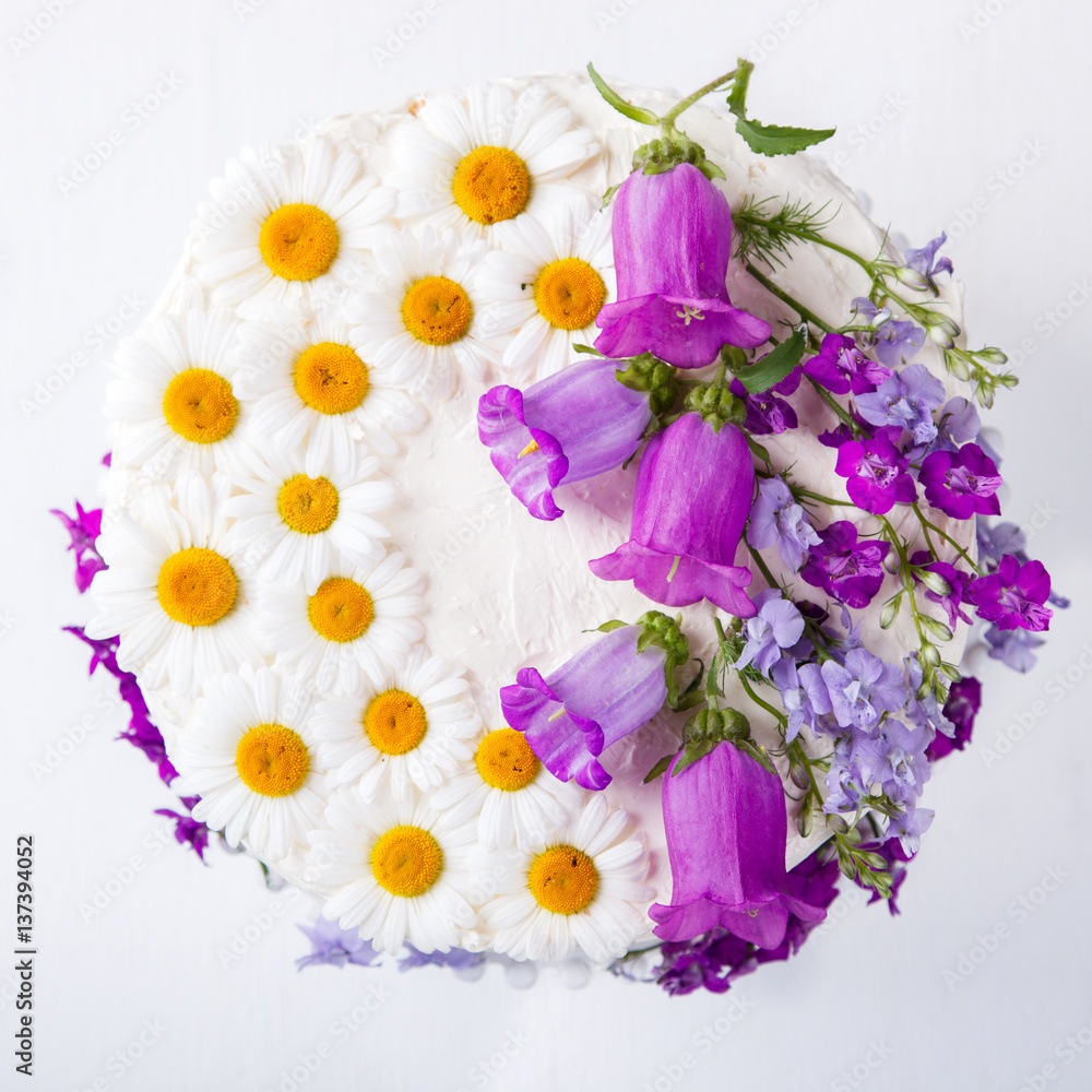 Cake Festive with Cream decorated with fresh Flowers.selective focus. Cake Festive with Cream decorated with fresh Flowers.selective focus.