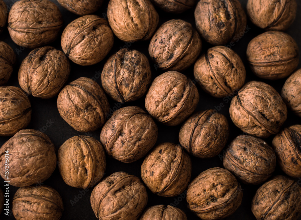 the texture of the walnuts in shell the texture of the walnuts in shell