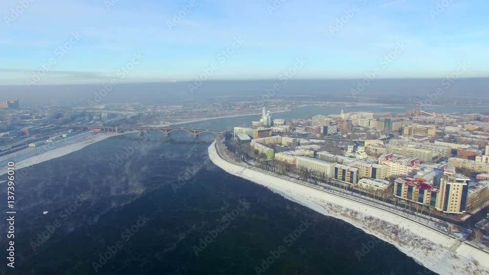 Aerial view from the air. Winter. Irkutsk city. Russia. Siberia. View of the bridge across the Angara River Aerial view from the air. Winter. Irkutsk city. Russia. Siberia. View of the bridge across the Angara River