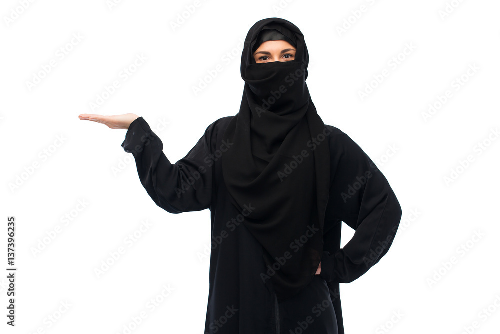 muslim woman in hijab holding empty hand