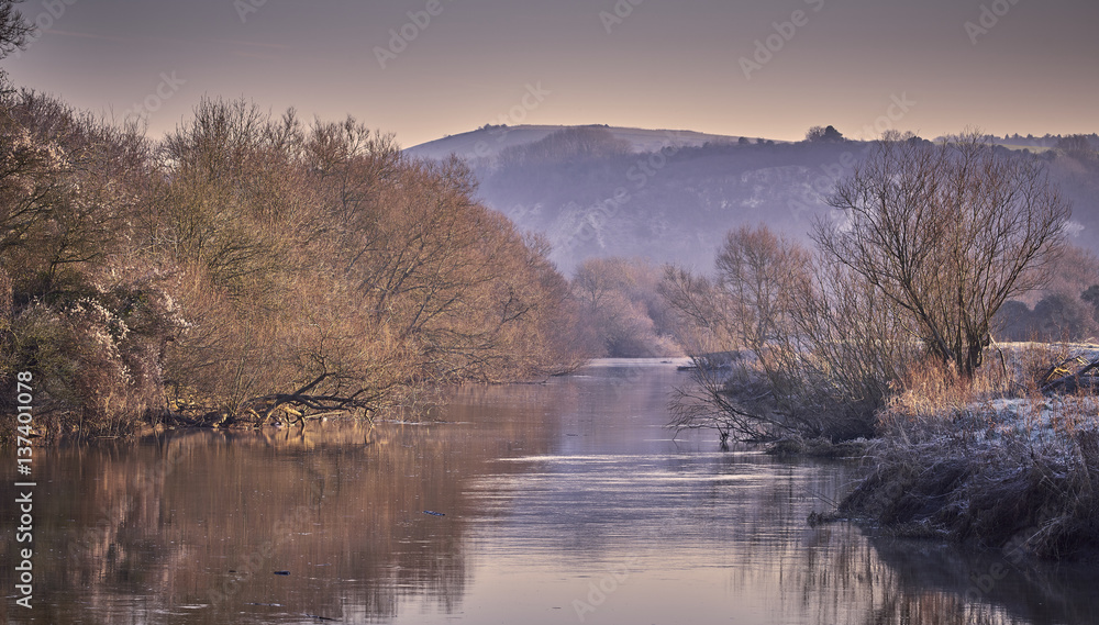 Fototapeta premium Frosty winter river landscape in the countryside