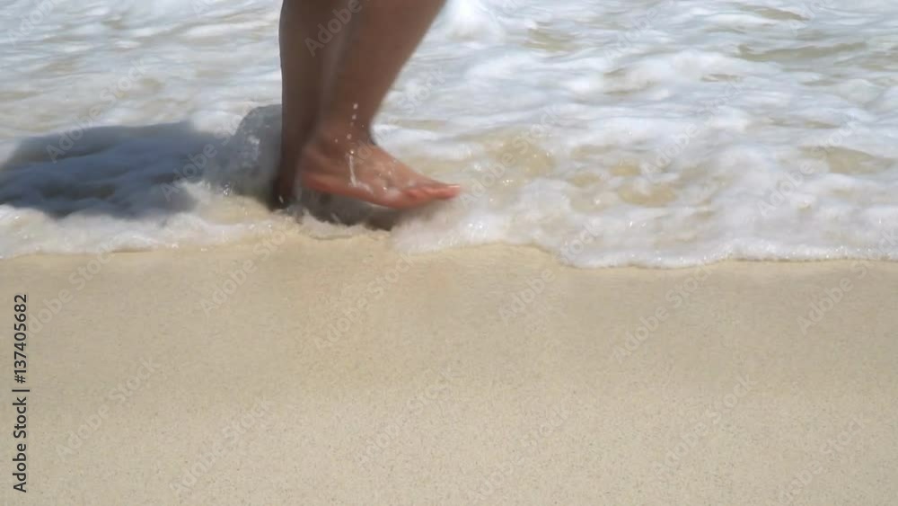 Close up feet of couple walking on beach Close up feet of couple walking on beach