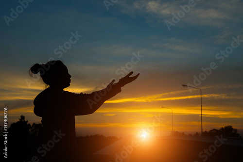 Fototapeta Naklejka Na Ścianę i Meble -  silhouette of woman hands with sunset light