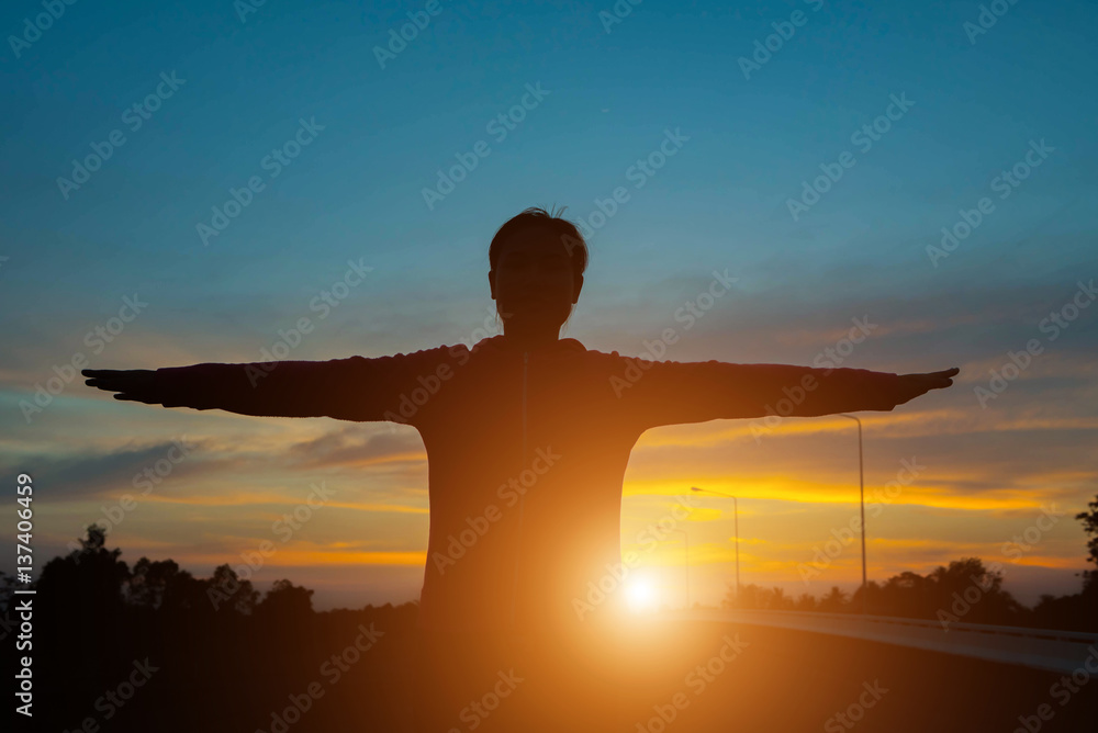 silhouette of woman pointing with finger in sky silhouette of woman pointing with finger in sky