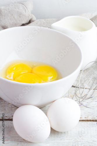 ingredients for omelet on a white wooden background close-up