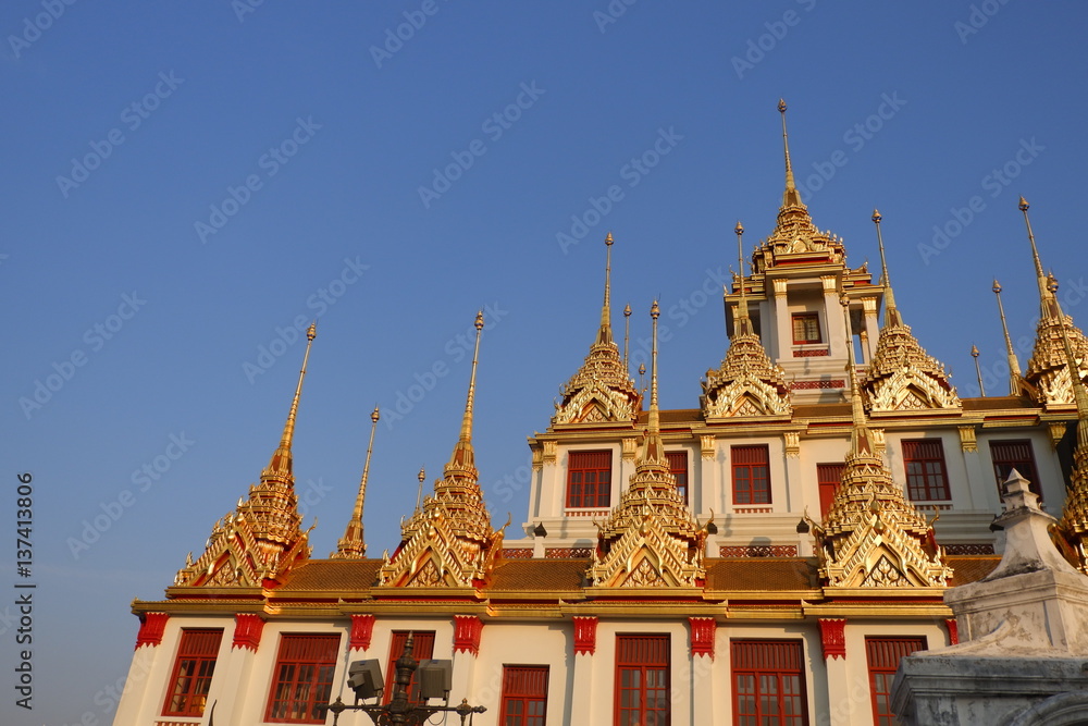 Naklejka premium Wat Ratchanatdaram ,Lohaprasat in Wat Ratchanatdaram Worawihan, beautiful temple view to skyline in Bangkok, Thailand