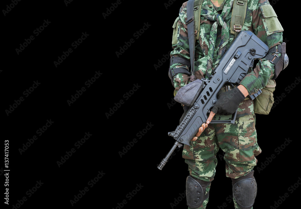 soldier in uniform holding automatic assault rifle on black background soldier in uniform holding automatic assault rifle on black background