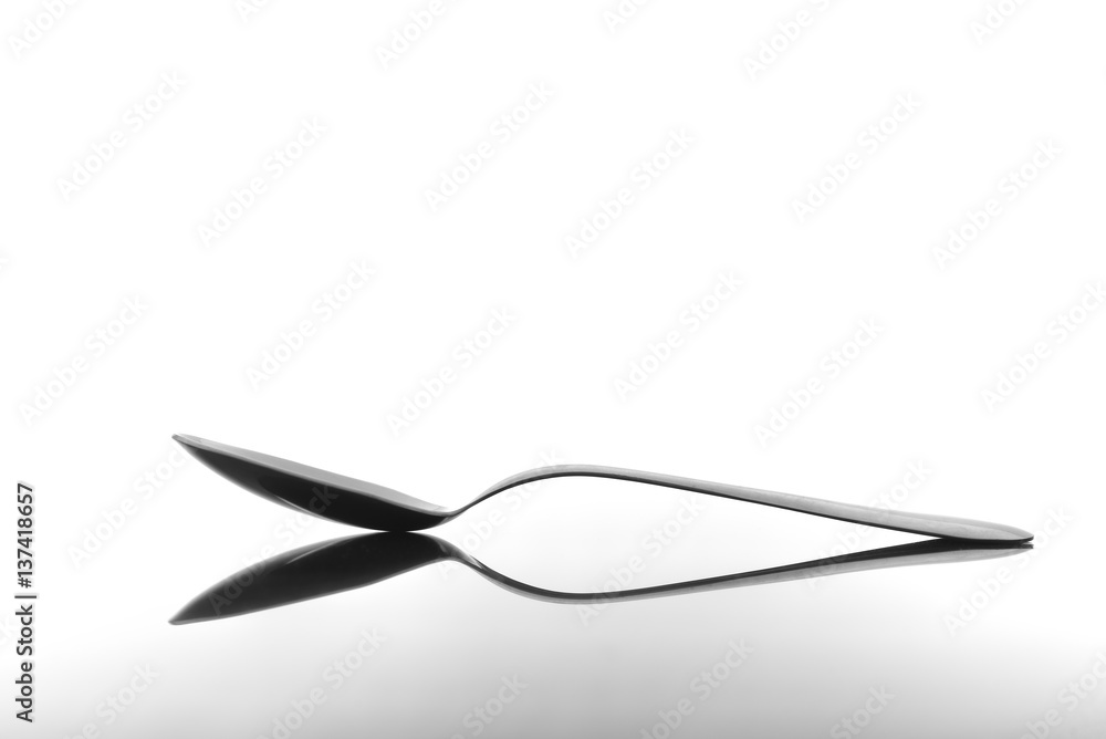 Spoon on glossy table surface
Spoon on glossy table surface
