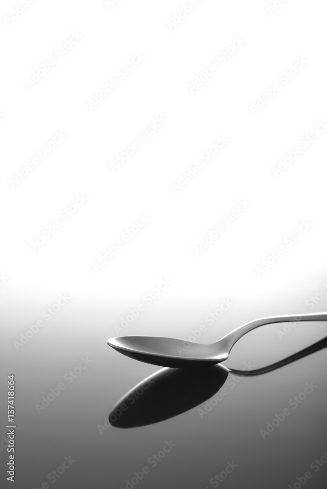 Spoon on glossy table surface
Spoon on glossy table surface