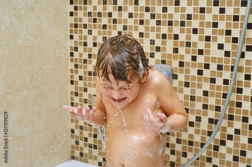 boy taking a shower