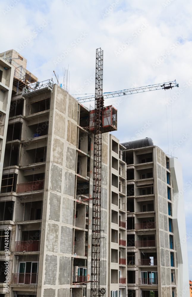 Fototapeta premium Crane and building construction site work.