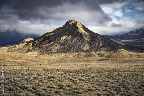 Mountain in the Nevada Desert with dramatic light and clouds. Chalk Mt. Middle Gate, NV
