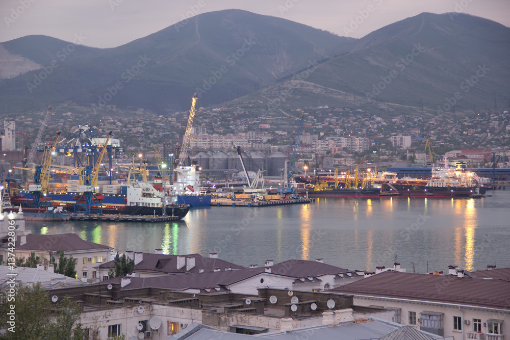 View of Novorossiysk commercial sea port after sunset. Novorossiysk is a major sea port in Russia