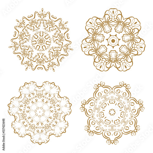 Set of 4 vector round golden lace design elements.