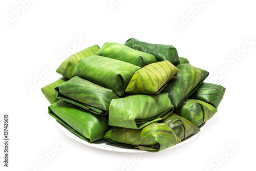 Glutinous rice steamed in banana leaf