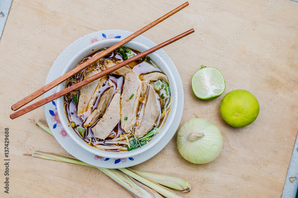 noodle duck with lime and onion on table noodle duck with lime and onion on table