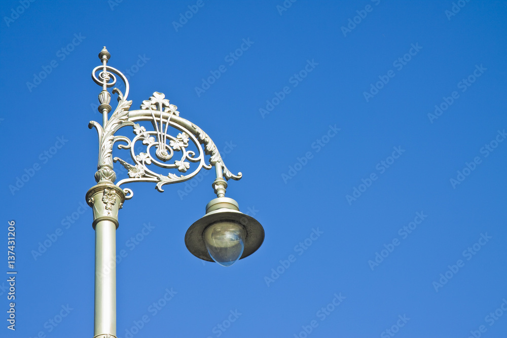 Typical classic Irish streetlight against a blue background - image with copy space Typical classic Irish streetlight against a blue background - image with copy space