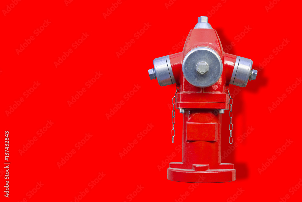 Red hydrant on red background - image with copy space Red hydrant on red background - image with copy space