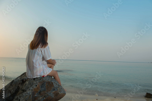 young woman on the beach,sad concept