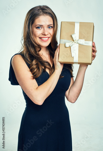 Happy woman holding gift box isolated portrait.