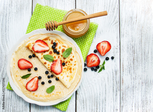 crepes with strawberries and blueberries