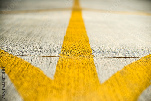 Fotografija Yellow direction strips closeup on an airfield runway.