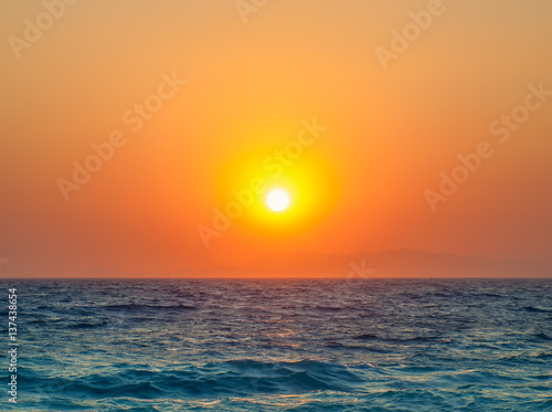 Mediterranean sea beautiful orange sunset travel background.