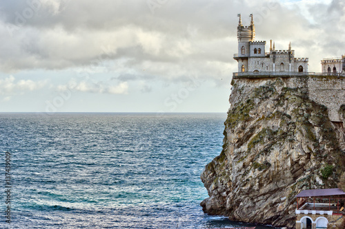 This is view of the castle Lastochkino gnezdo, the rock and Black sea. Gaspra, Crimea photo