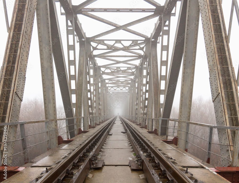 railroad goes into the mist. gray misty autumn morning. railroad goes into the mist. gray misty autumn morning.