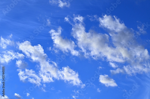 White clouds in the blue sky. Weather background