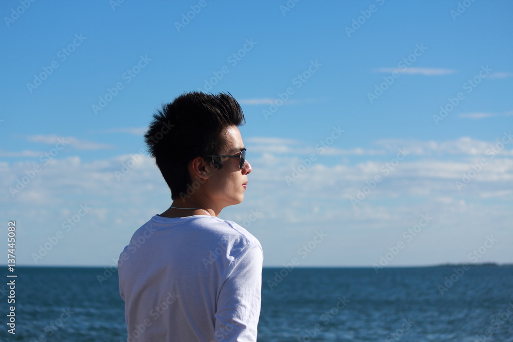 Young man relaxing on the beach Young man relaxing on the beach