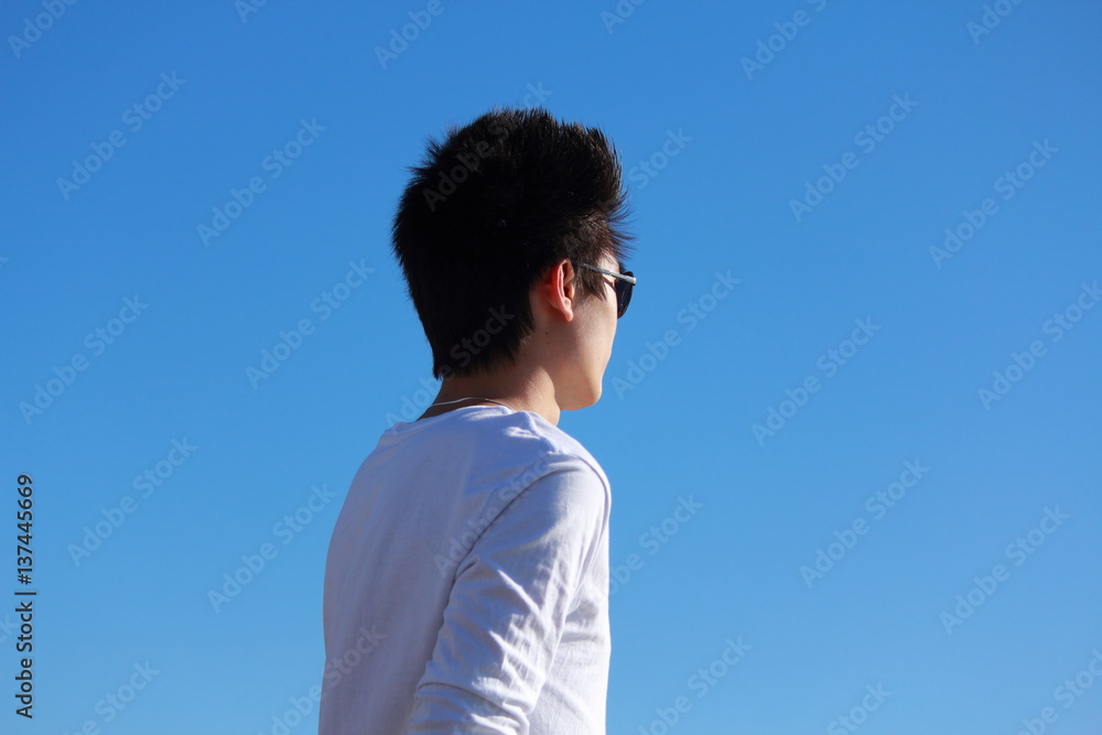 Young man relaxing on the beach Young man relaxing on the beach