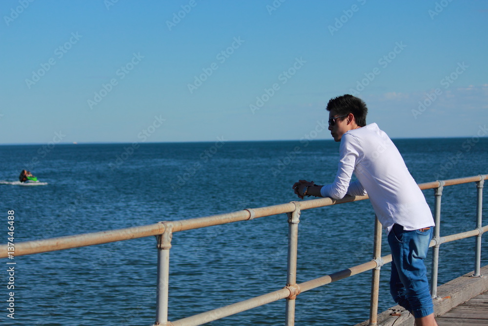 Young man relaxing on the beach