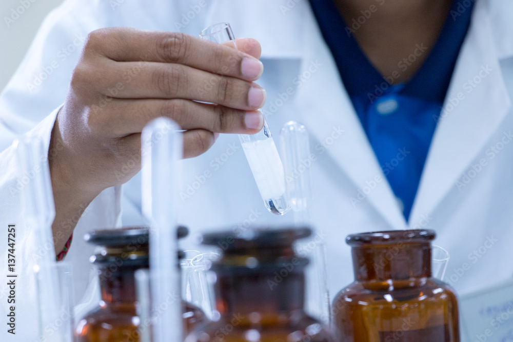 scientist researching in laboratory. scientist researching in laboratory.